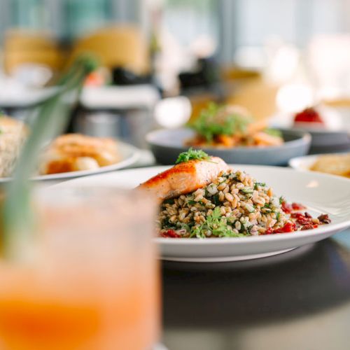 A table of brunch dishes with scrambled eggs, toast, sides, and drinks, set in a bright, cozy dining scene. Top it at 140 characters, always ending the sentence.